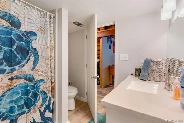 a en suite bathroom with a sink and toilet