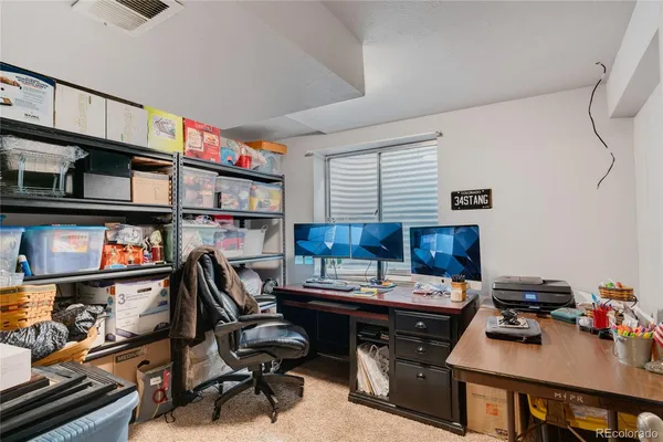 a view of a workspace with furniture