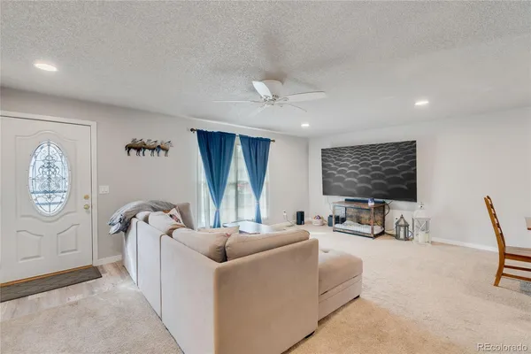 a living room with furniture a window and couch