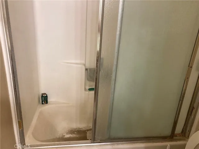 a large kitchen with stainless steel appliances a cabinets and a counter top space