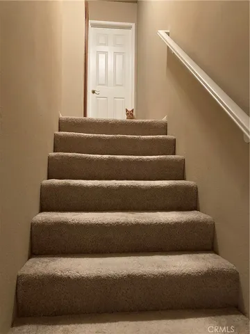 a kitchen with a sink and a refrigerator