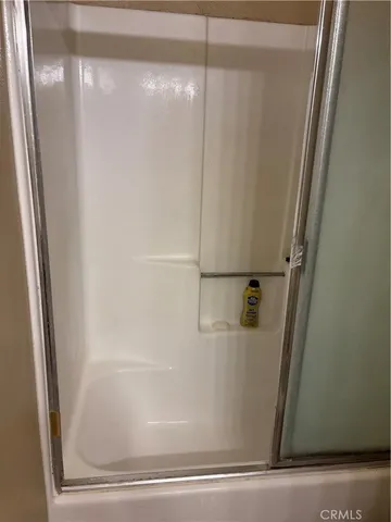 a kitchen with kitchen island a sink and a stove with wooden floor