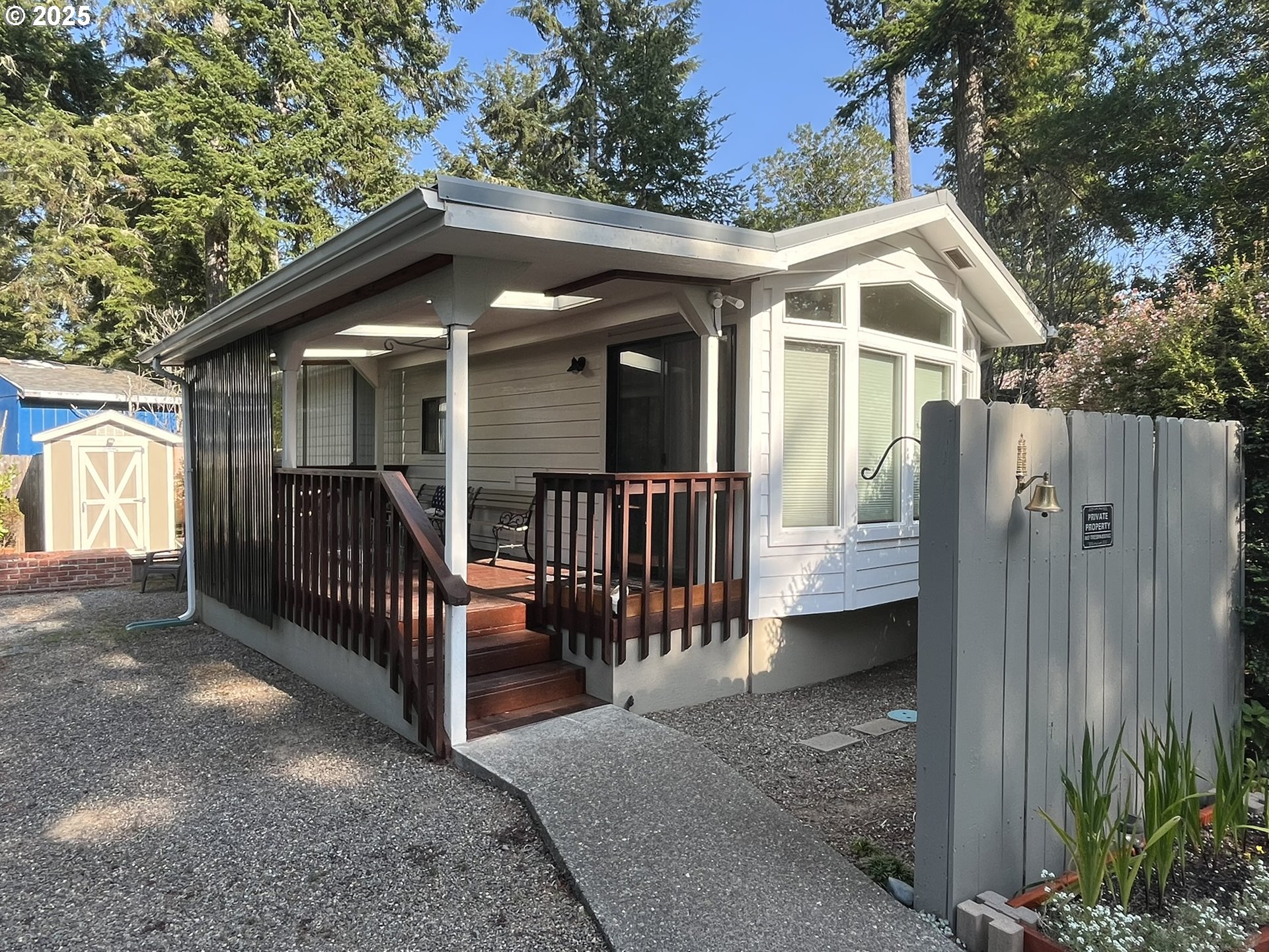 225 Azalea Street Florence, OR 97439 - Photo 1 of 15 a view of a house with a porch