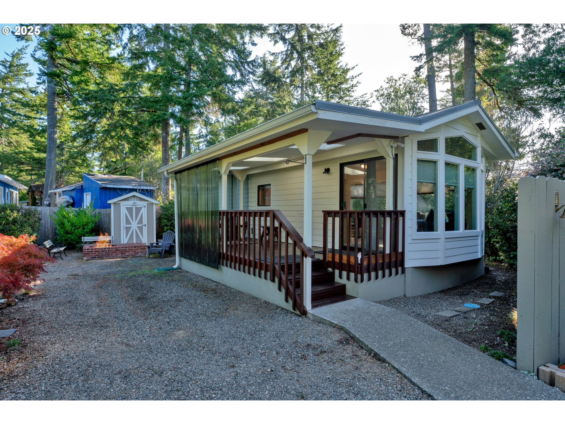 225 Azalea Street Florence, OR 97439 - Photo 15 of 15 a view of a house with a yard and deck