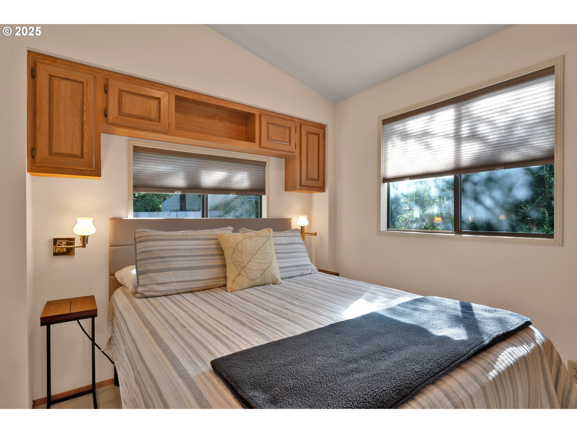 225 Azalea Street Florence, OR 97439 - Photo 9 of 15 a bedroom with a bed and a large window