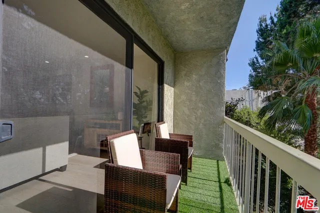a view of balcony with furniture