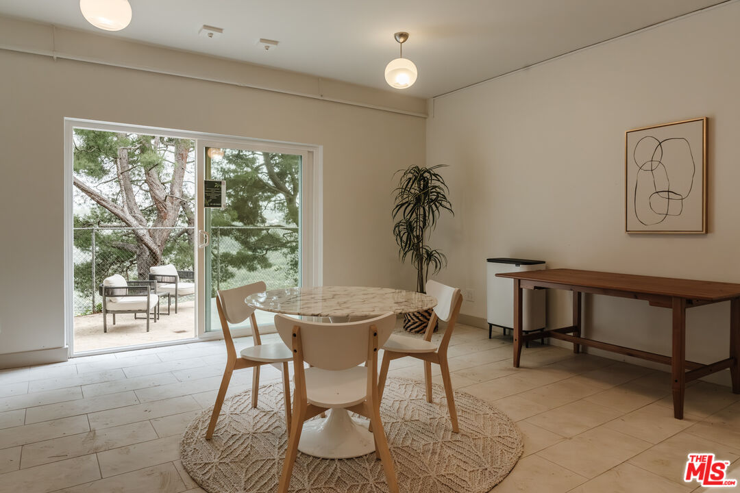 2345 Roscomare Road, Unit 303 Los Angeles, CA 90077 - Photo 21 of 23 a view of a dining room with furniture window and outside view
