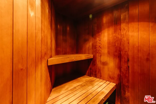 a bedroom with a bed and curtain