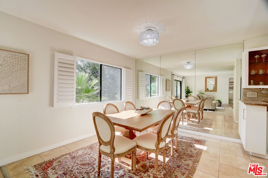 2345 Roscomare Road, Unit 303 Los Angeles, CA 90077 - Photo 7 of 23 a dining room with furniture and wooden floor