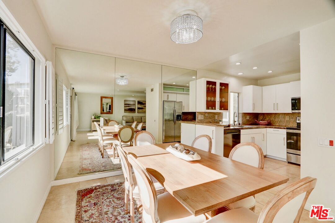 2345 Roscomare Road, Unit 303 Los Angeles, CA 90077 - Photo 9 of 23 a view of a dining room with furniture