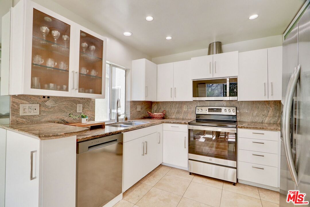2345 Roscomare Road, Unit 303 Los Angeles, CA 90077 - Photo 10 of 23 a kitchen with a sink stove and microwave
