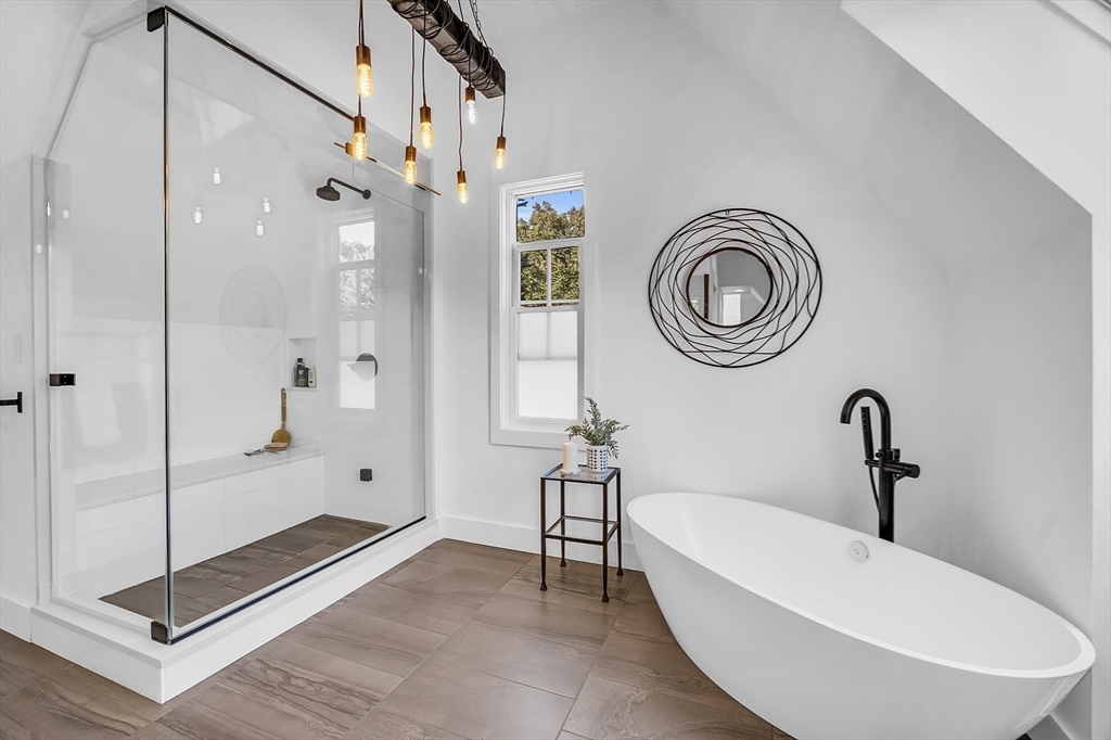 38 Downing Road Lexington, MA 02421 - Photo 19 of 41 a bathroom with a tub a toilet and a shower