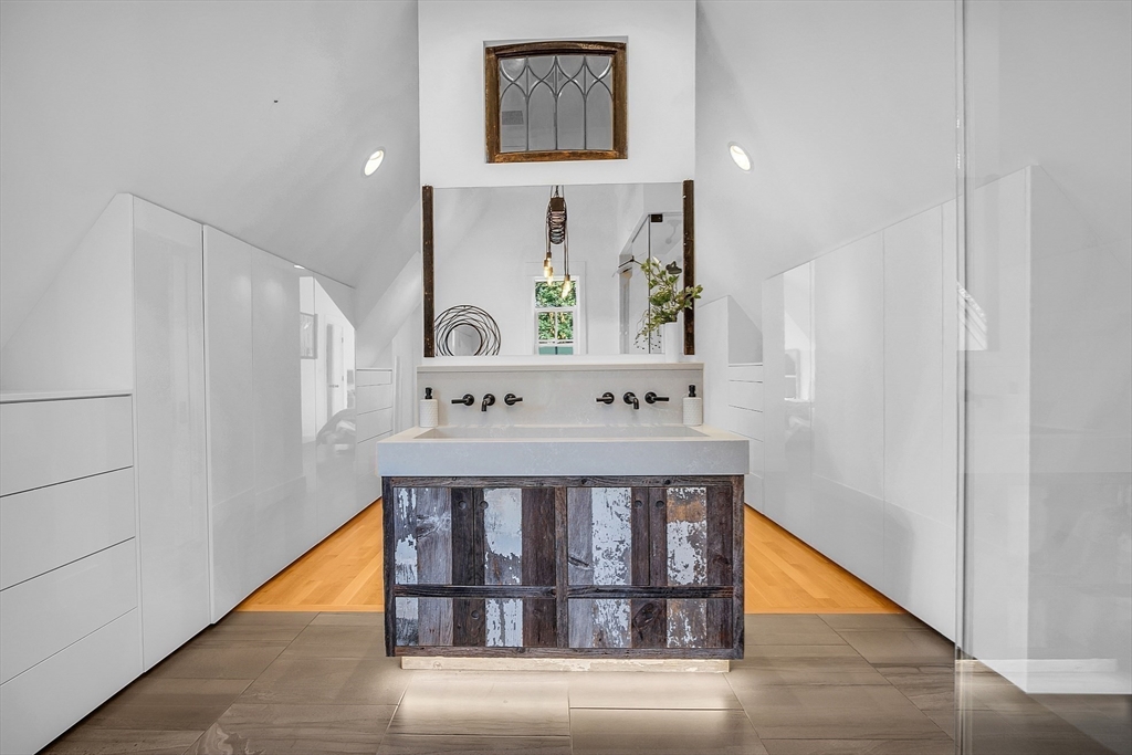 38 Downing Road Lexington, MA 02421 - Photo 21 of 41 a view of a hallway with wooden floor and staircase