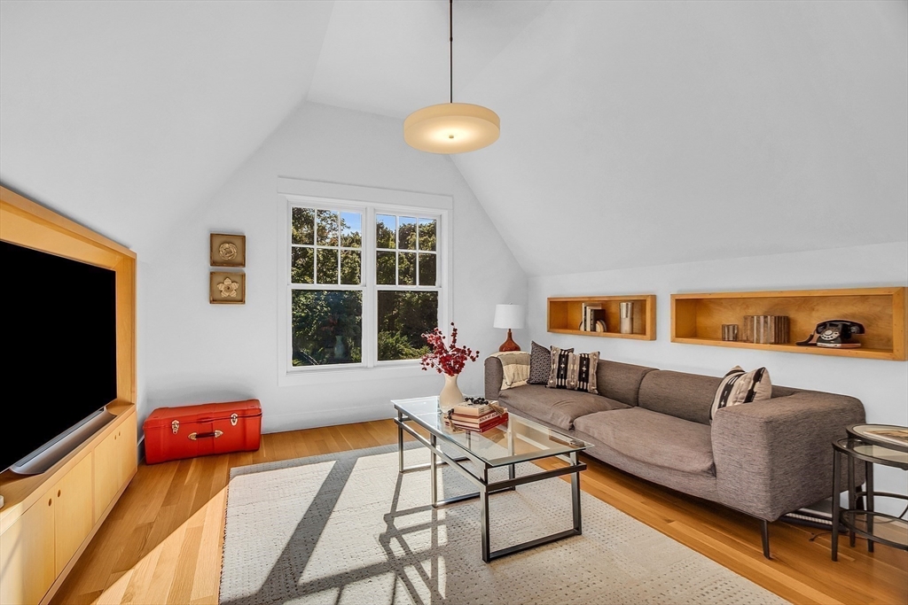 38 Downing Road Lexington, MA 02421 - Photo 22 of 41 a living room with furniture and a flat screen tv
