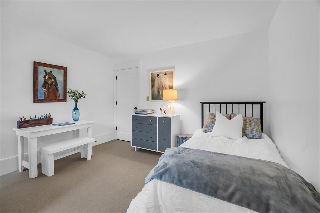 38 Downing Road Lexington, MA 02421 - Photo 25 of 41 a bedroom with a bed and a desk