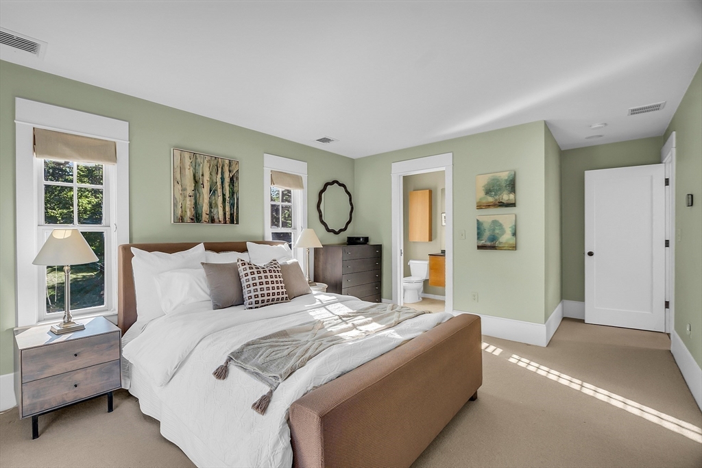 38 Downing Road Lexington, MA 02421 - Photo 26 of 41 a bedroom with a bed and large windows