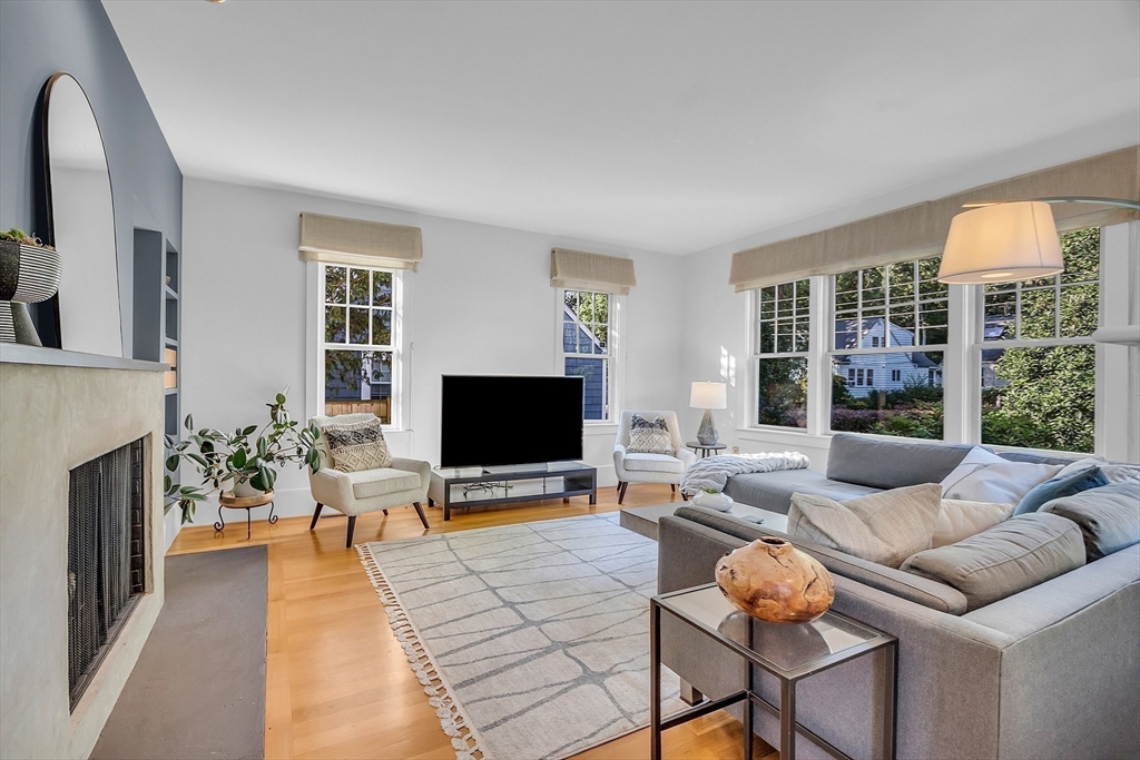 38 Downing Road Lexington, MA 02421 - Photo 4 of 41 a living room with furniture and a flat screen tv