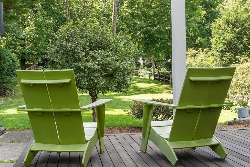 38 Downing Road Lexington, MA 02421 - Photo 41 of 41 a green field with sitting area in front of a house