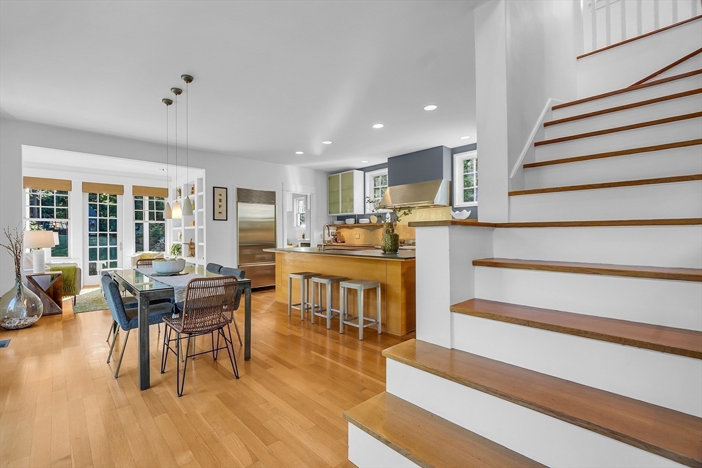 38 Downing Road Lexington, MA 02421 - Photo 8 of 41 a living room with furniture and a dining table with wooden floor