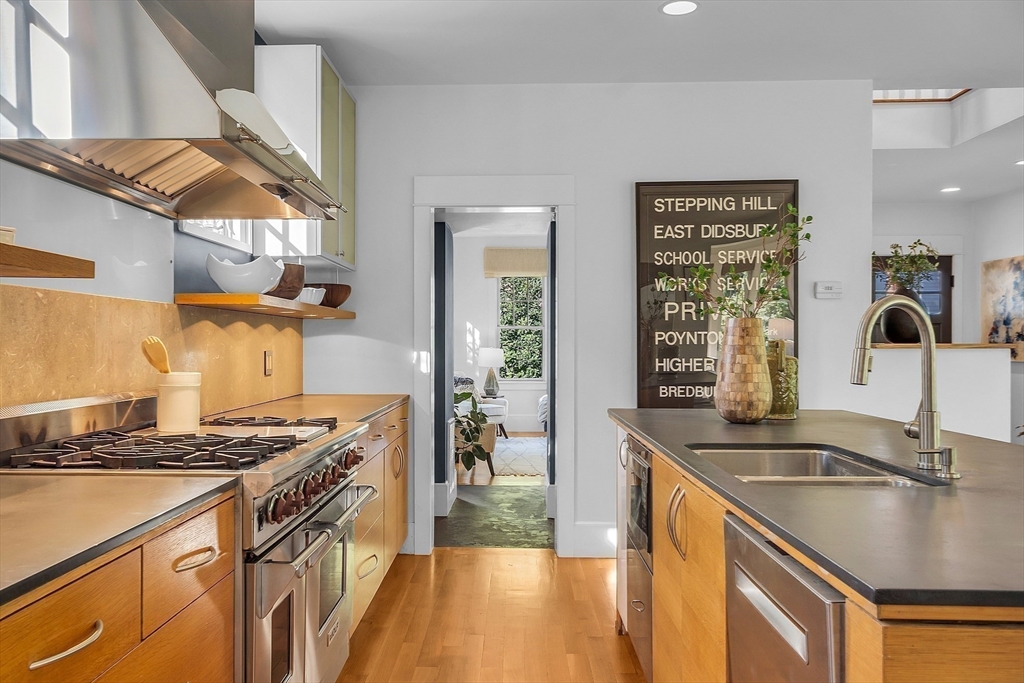 38 Downing Road Lexington, MA 02421 - Photo 10 of 41 a kitchen with stainless steel appliances granite countertop a sink stove and refrigerator