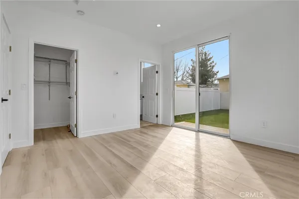 a view of kitchen with granite countertop stainless steel appliances and sink