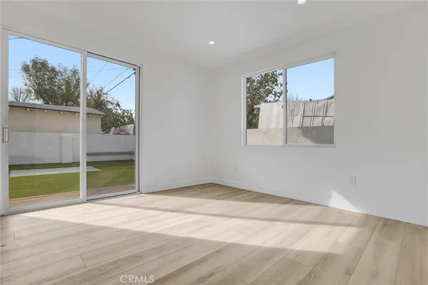a living room with kitchen island furniture and a kitchen view
