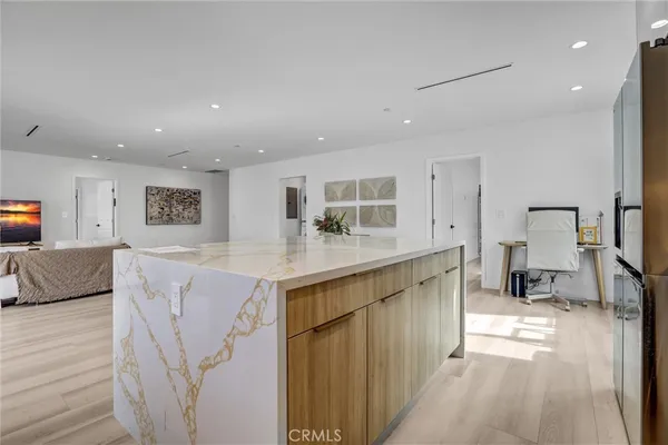 a kitchen with stainless steel appliances granite countertop a sink and cabinets
