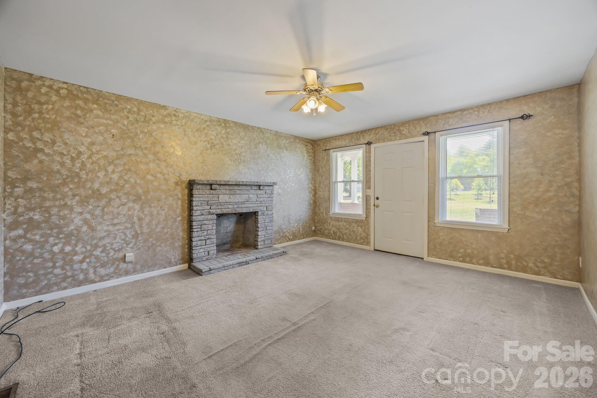 1311 Jenkins Road Gastonia, NC 28052 - Photo 15 of 47 an empty room with windows and fireplace
