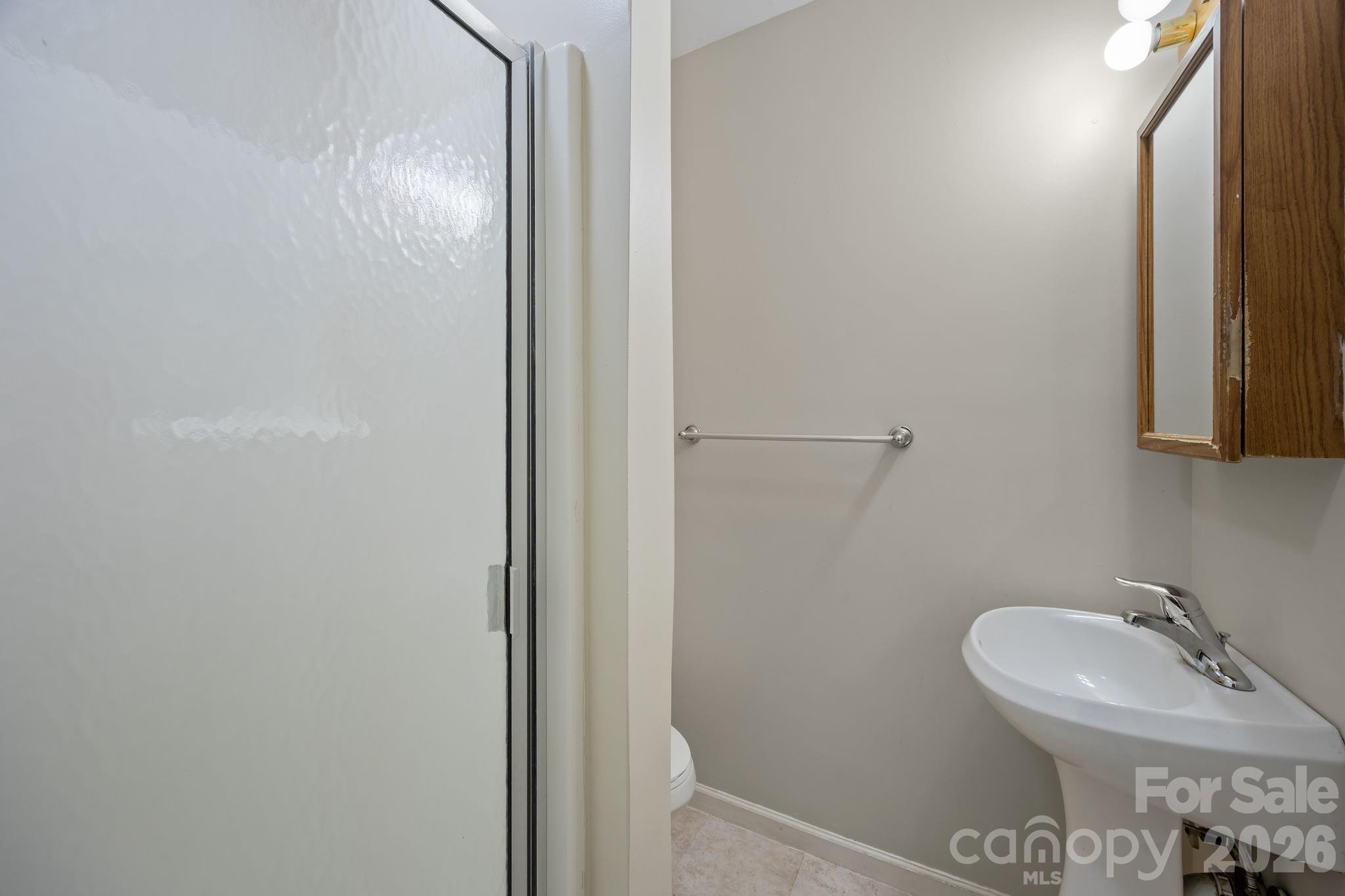 1311 Jenkins Road Gastonia, NC 28052 - Photo 19 of 47 a bathroom with a sink and a mirror