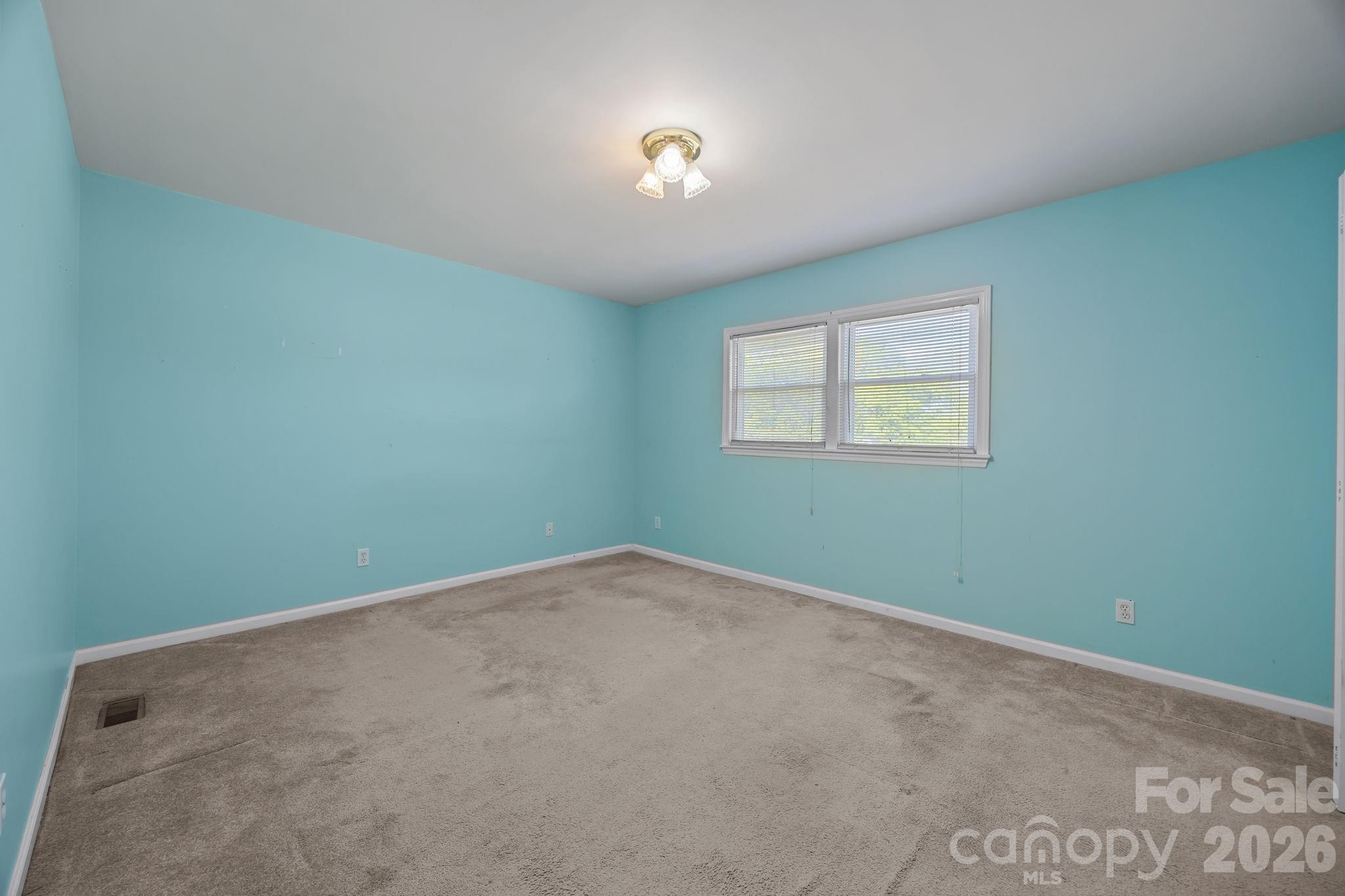 1311 Jenkins Road Gastonia, NC 28052 - Photo 20 of 47 an empty room with windows