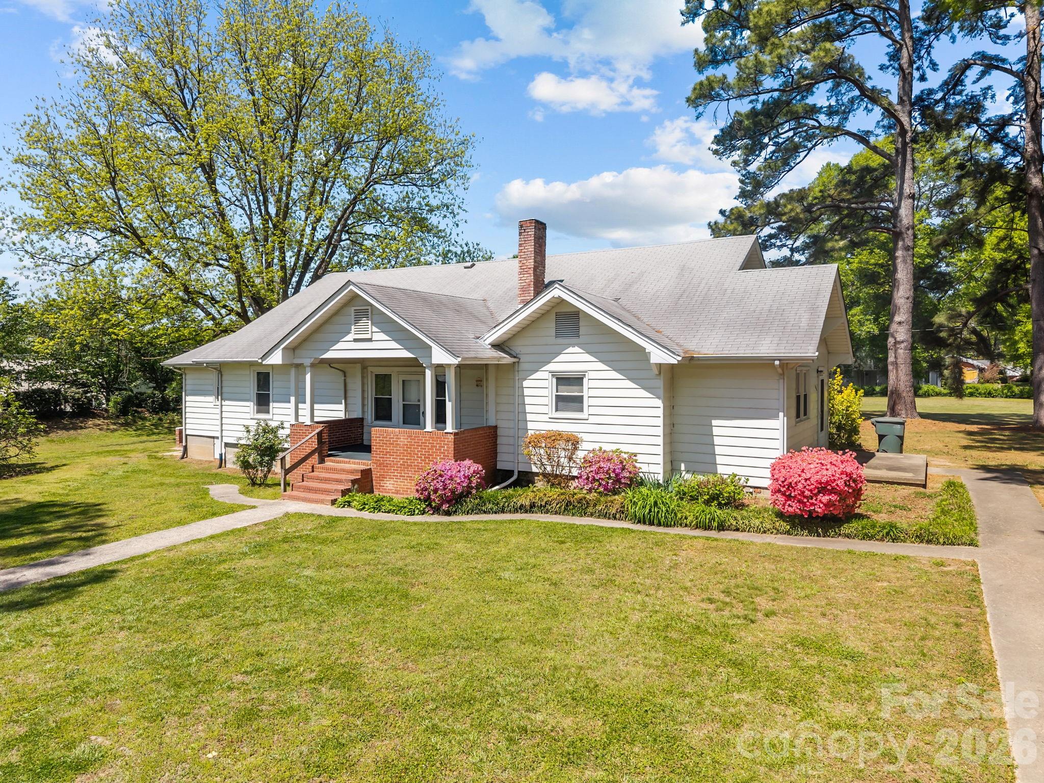 1311 Jenkins Road Gastonia, NC 28052 - Photo 2 of 47 a front view of house with yard and outdoor seating