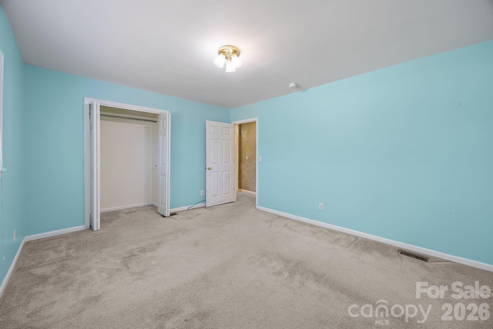 1311 Jenkins Road Gastonia, NC 28052 - Photo 21 of 47 an empty room with closet