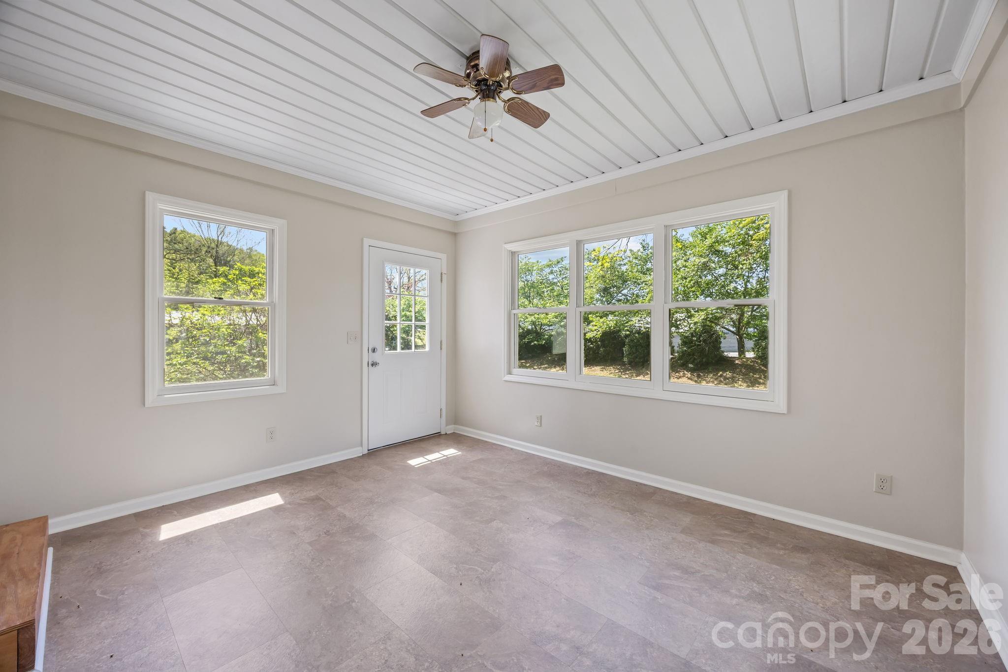 1311 Jenkins Road Gastonia, NC 28052 - Photo 32 of 47 a view of a livingroom with a ceiling fan and window
