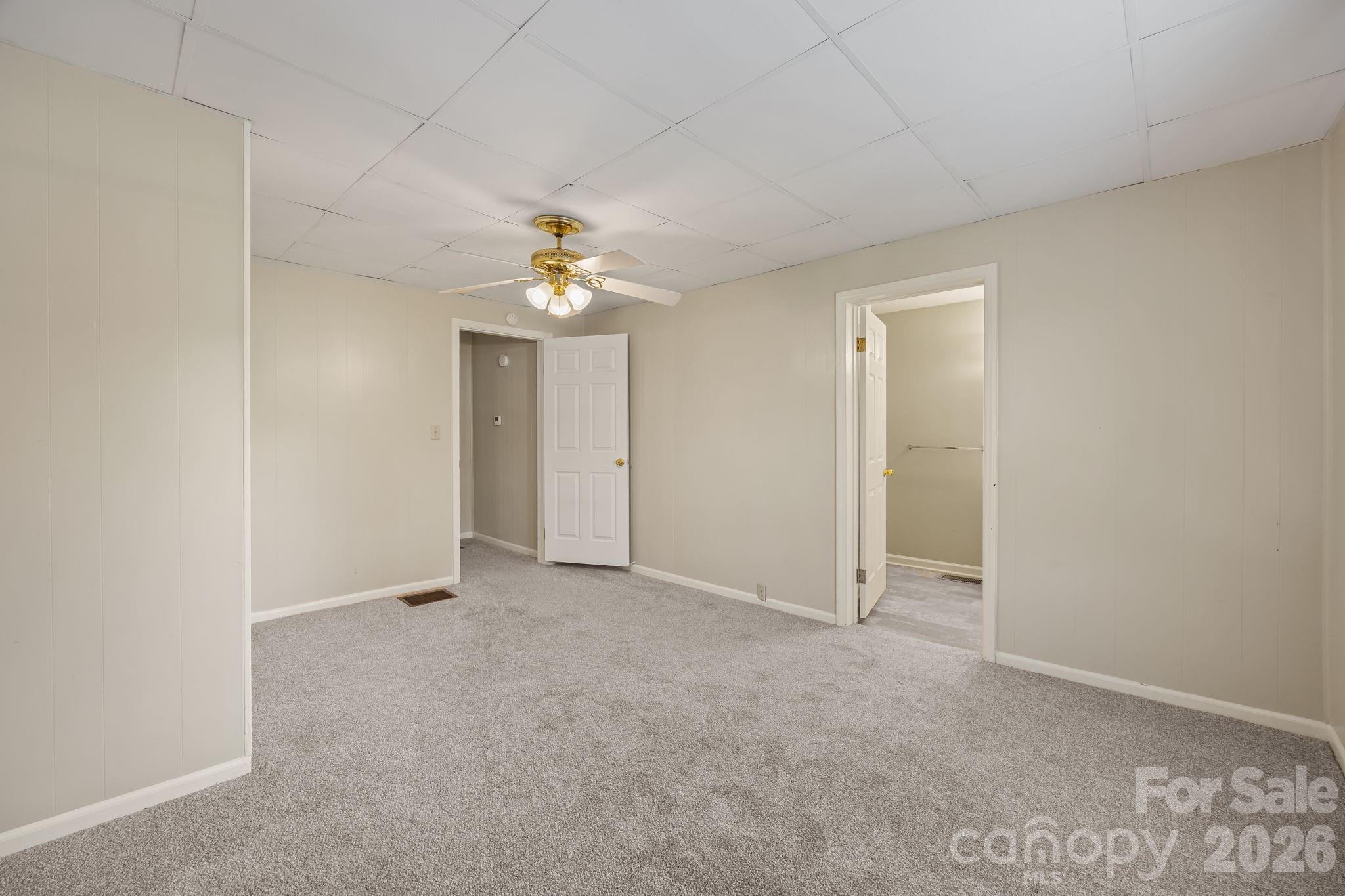 1311 Jenkins Road Gastonia, NC 28052 - Photo 38 of 47 an empty room with chandelier fan
