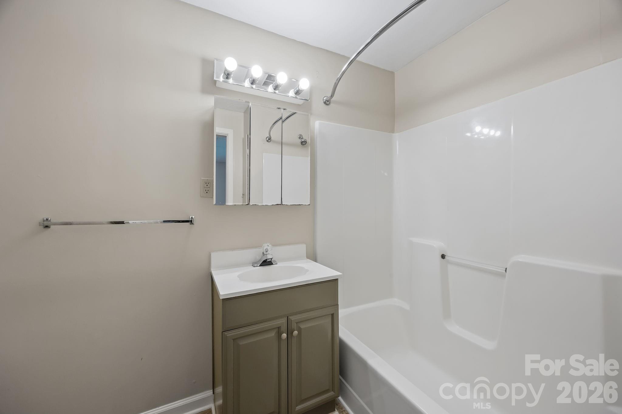 1311 Jenkins Road Gastonia, NC 28052 - Photo 39 of 47 a bathroom with a sink a toilet and shower