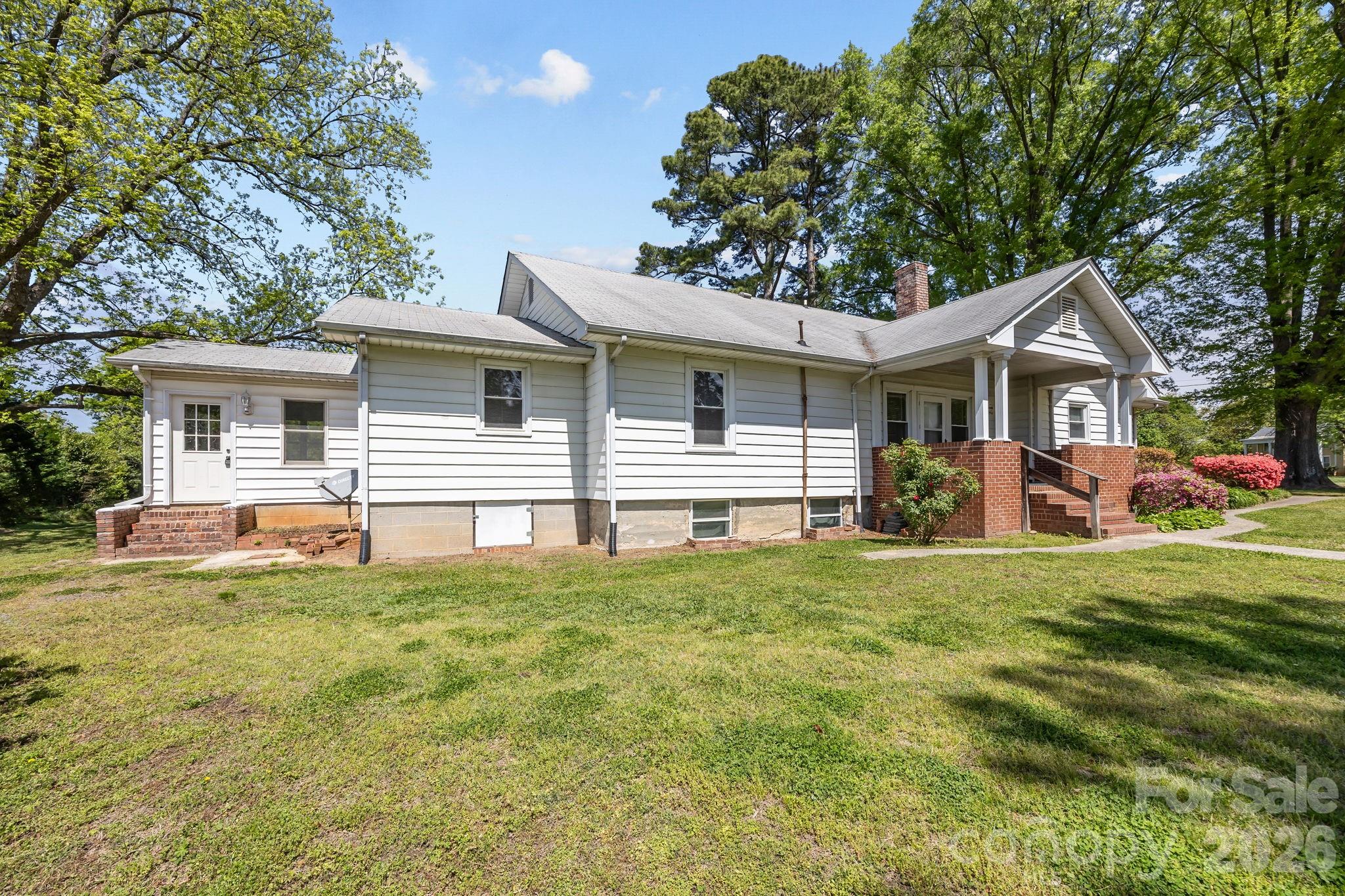 1311 Jenkins Road Gastonia, NC 28052 - Photo 43 of 47 a front view of a house with a garden
