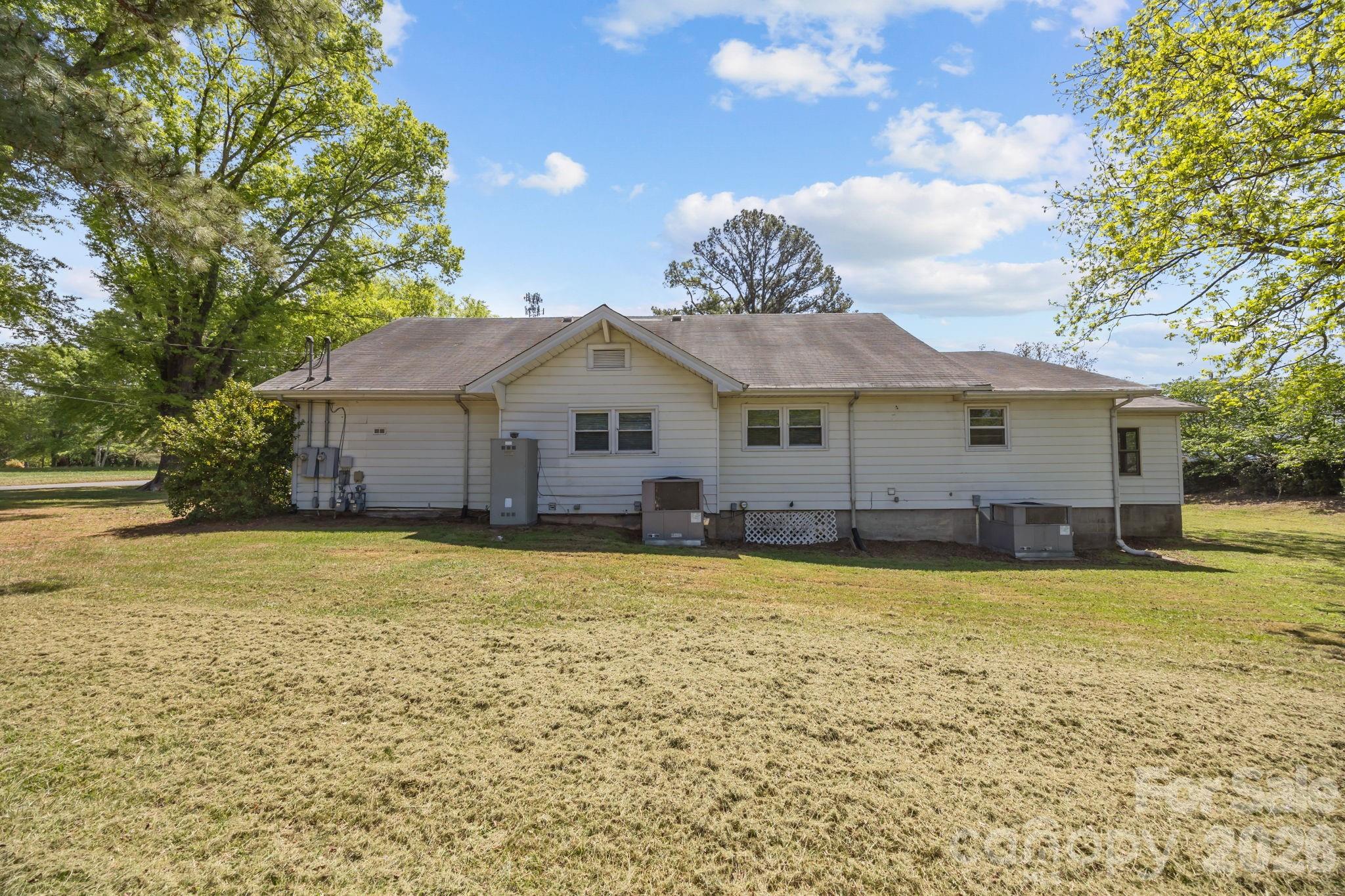 1311 Jenkins Road Gastonia, NC 28052 - Photo 45 of 47 a house with swimming pool in front of it