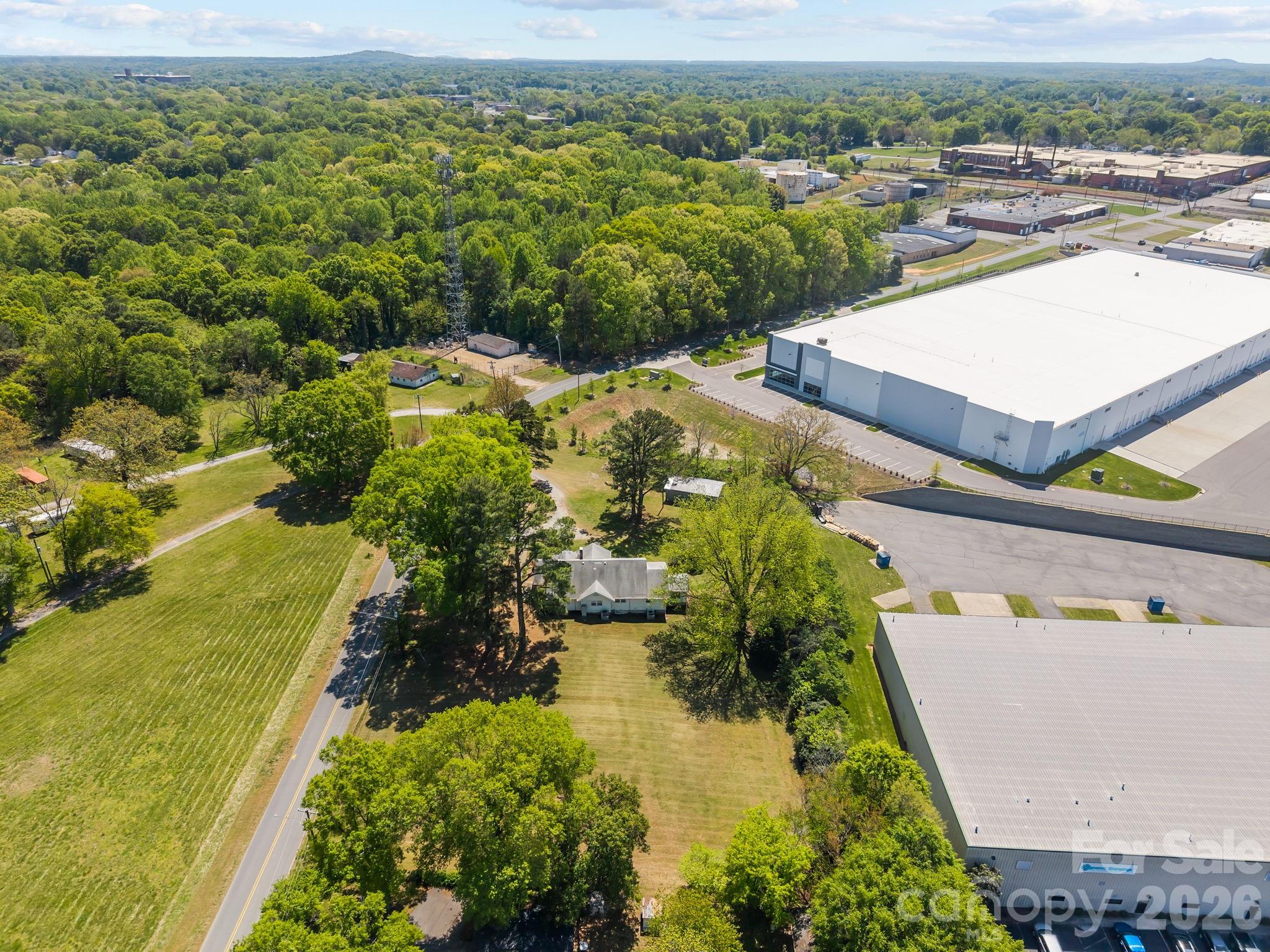 1311 Jenkins Road Gastonia, NC 28052 - Photo 5 of 47 an aerial view of residential houses with outdoor space and swimming pool