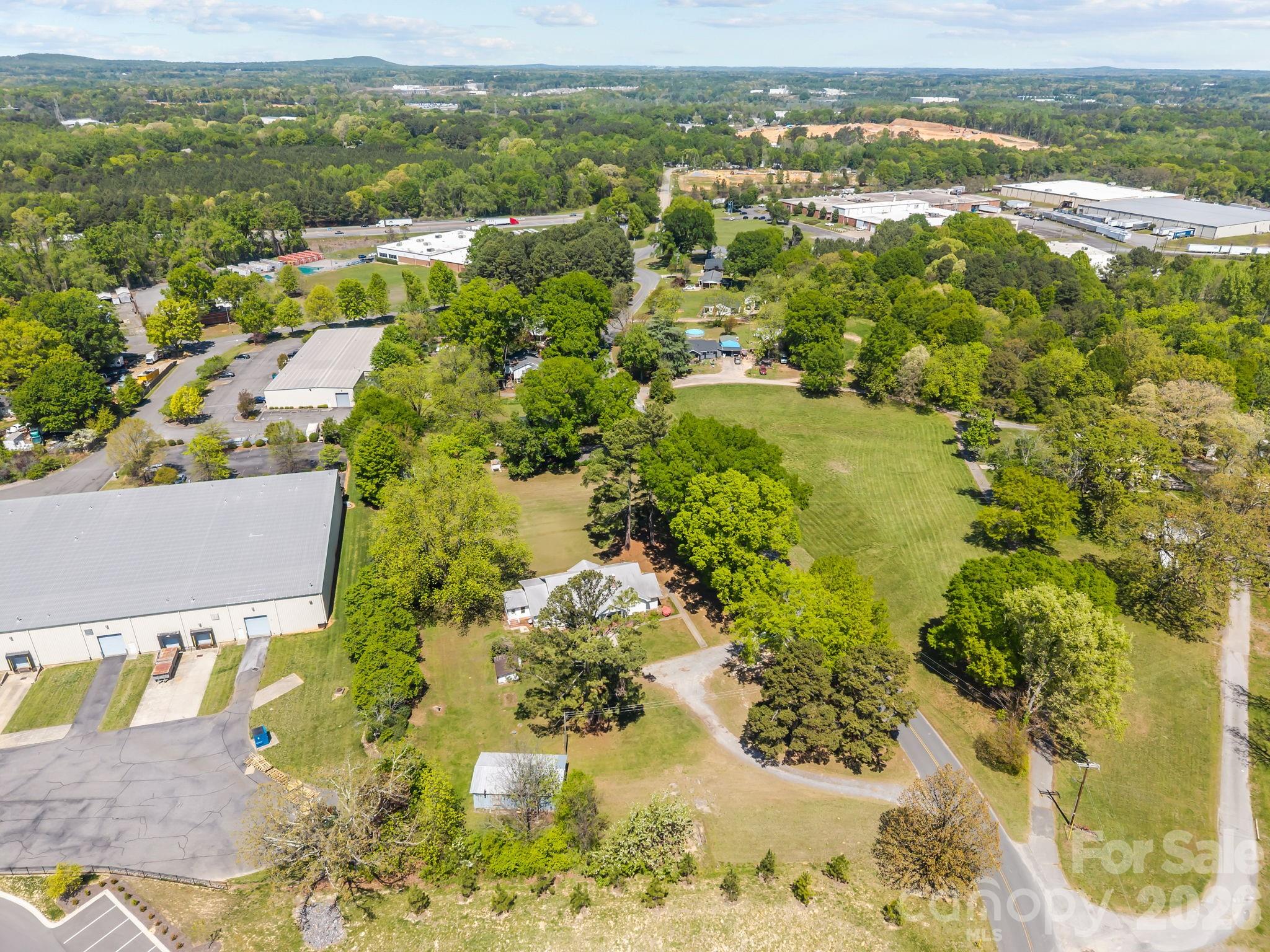 1311 Jenkins Road Gastonia, NC 28052 - Photo 7 of 47 an aerial view of residential houses with outdoor space