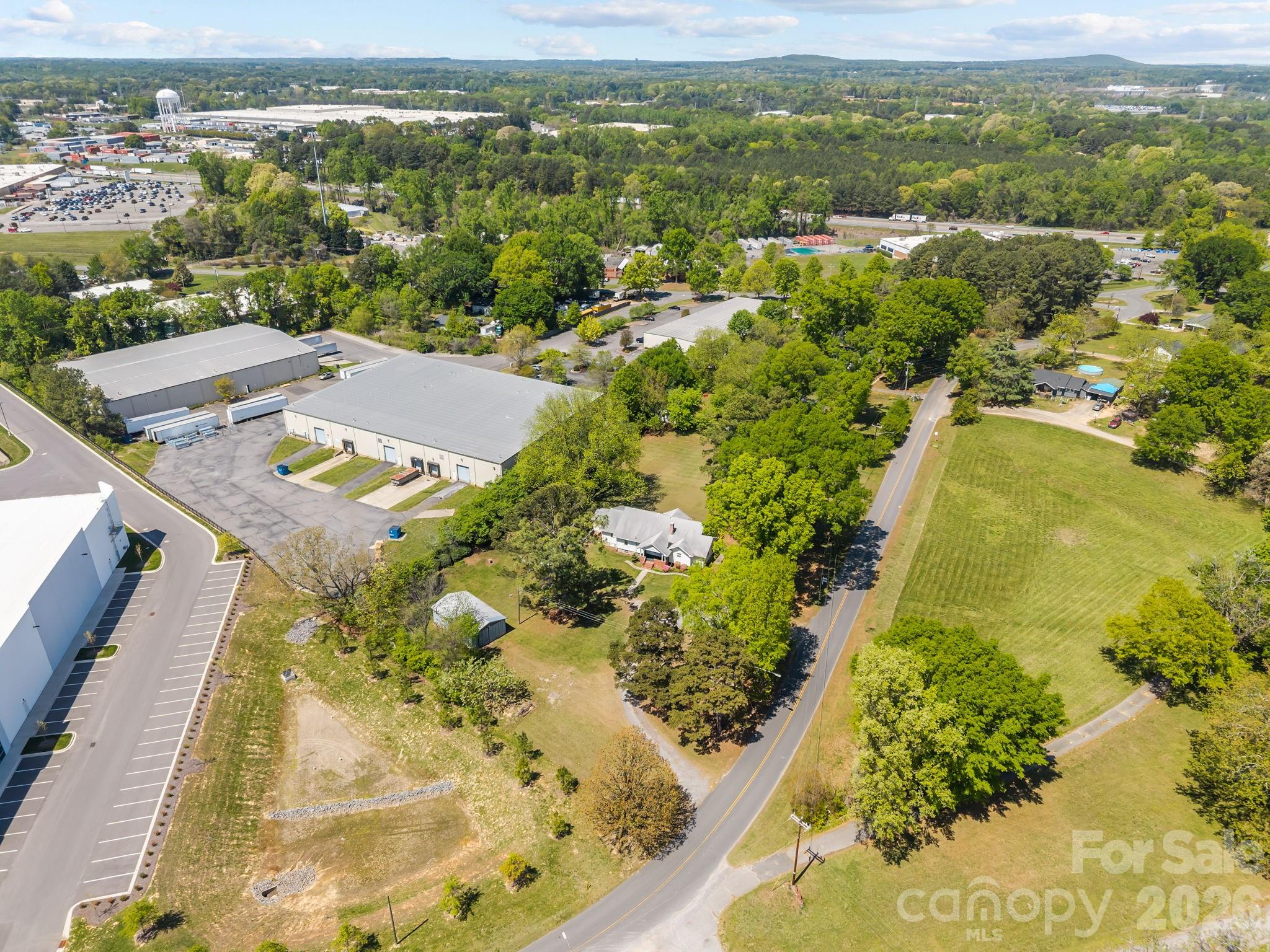 1311 Jenkins Road Gastonia, NC 28052 - Photo 8 of 47 an aerial view of residential houses with outdoor space