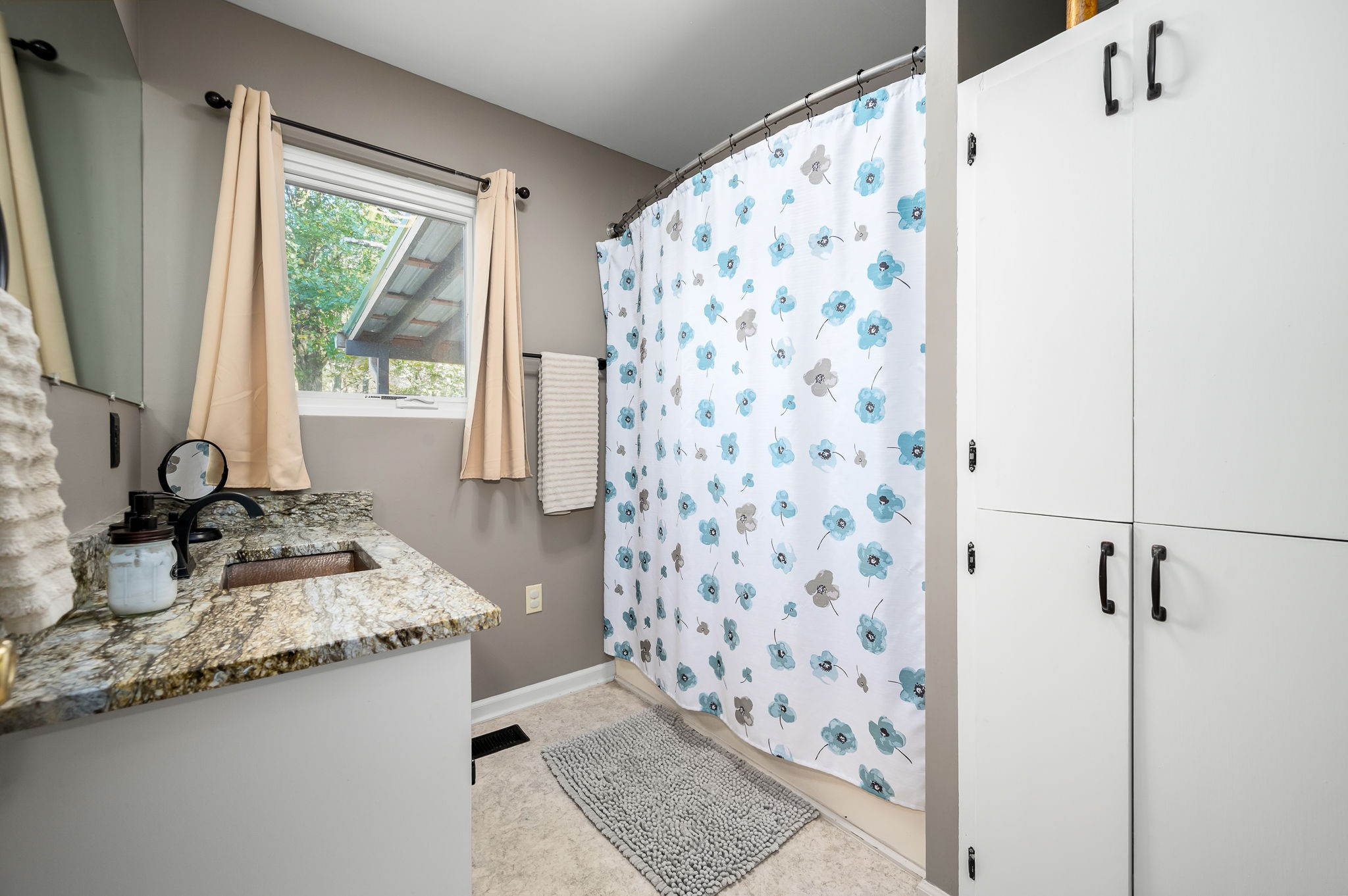 109 Higgins Road Woodbury, TN 37190 - Photo 24 of 49 The main bathroom with built-in cabinets.