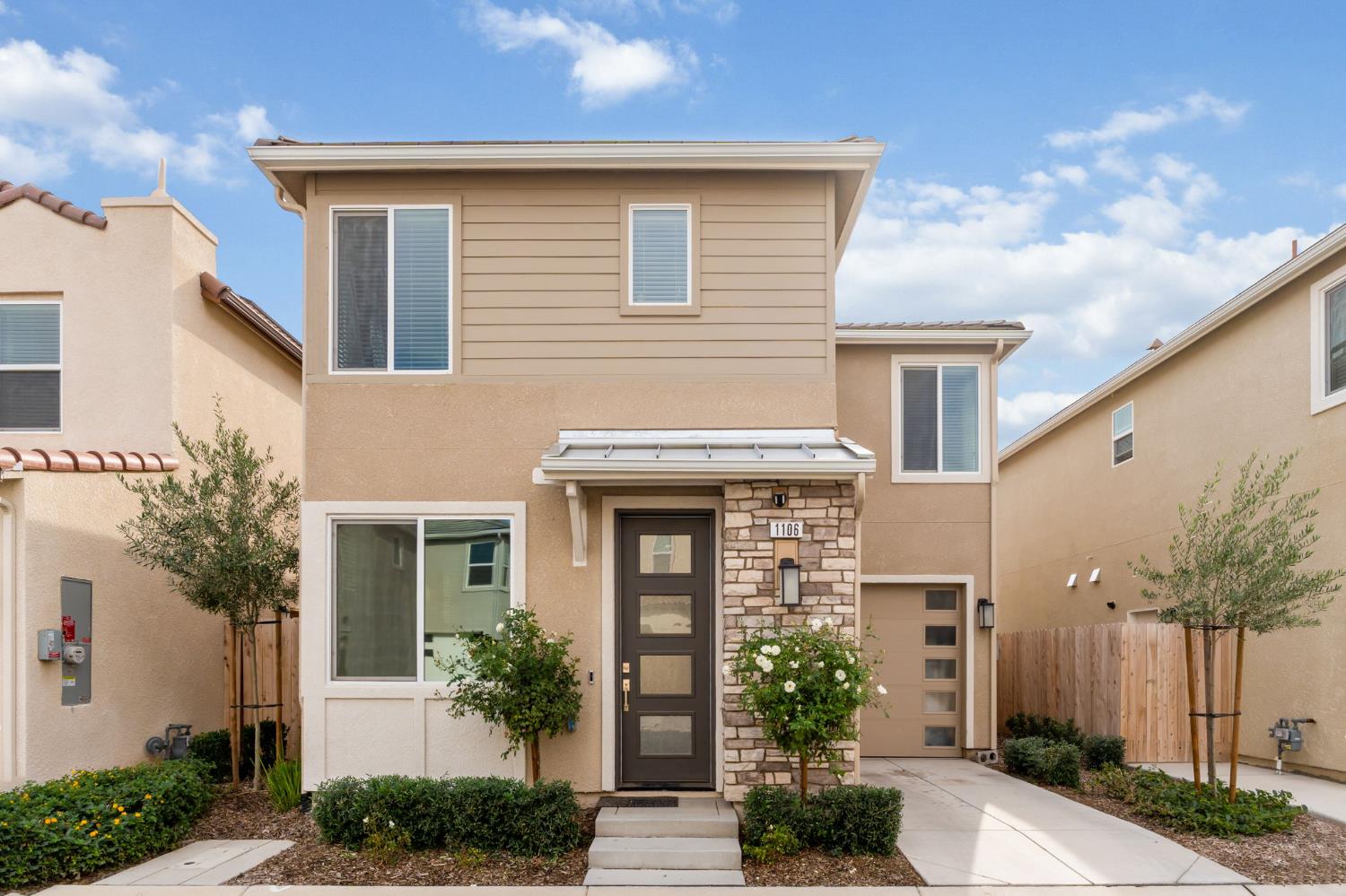 1106 Significant Way West Madera, CA 93636 - Photo 1 of 41 a front view of a house with garden