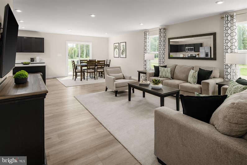 9205 Cooks Point Court, Unit 29 Lanham, MD 20706 - Photo 7 of 14 a living room with furniture and a flat screen tv
