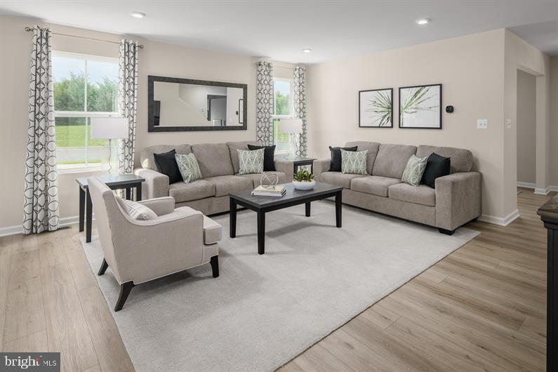 9205 Cooks Point Court, Unit 29 Lanham, MD 20706 - Photo 8 of 14 a living room with furniture and a large window