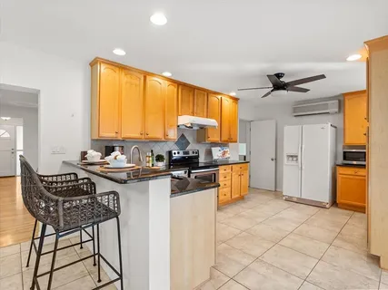 an aerial view of a house with a swimming pool