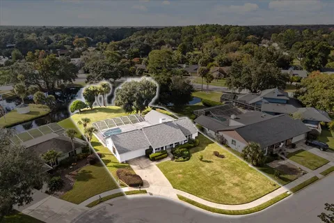 a view of a backyard with swimming pool