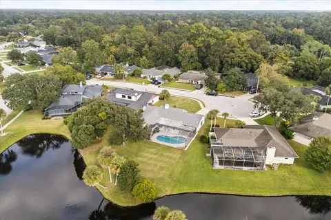 a view of a swimming pool with an outdoor seating