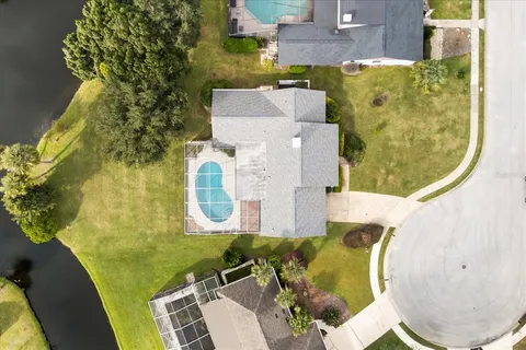 a view of a livingroom with a ceiling fan and window