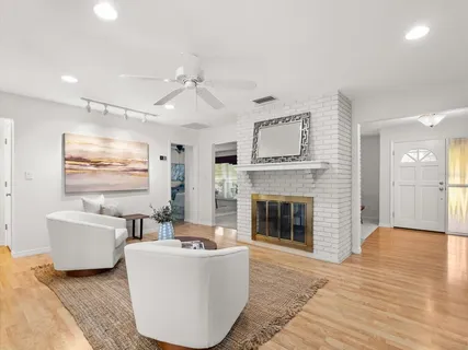 a living room with furniture and white walls