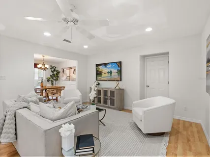 a living room with furniture and a potted plant